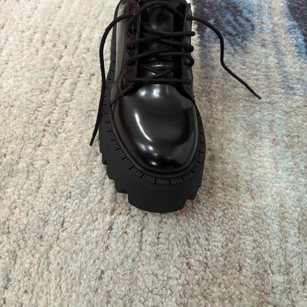 Black women’s combat style shoe with platform heel
